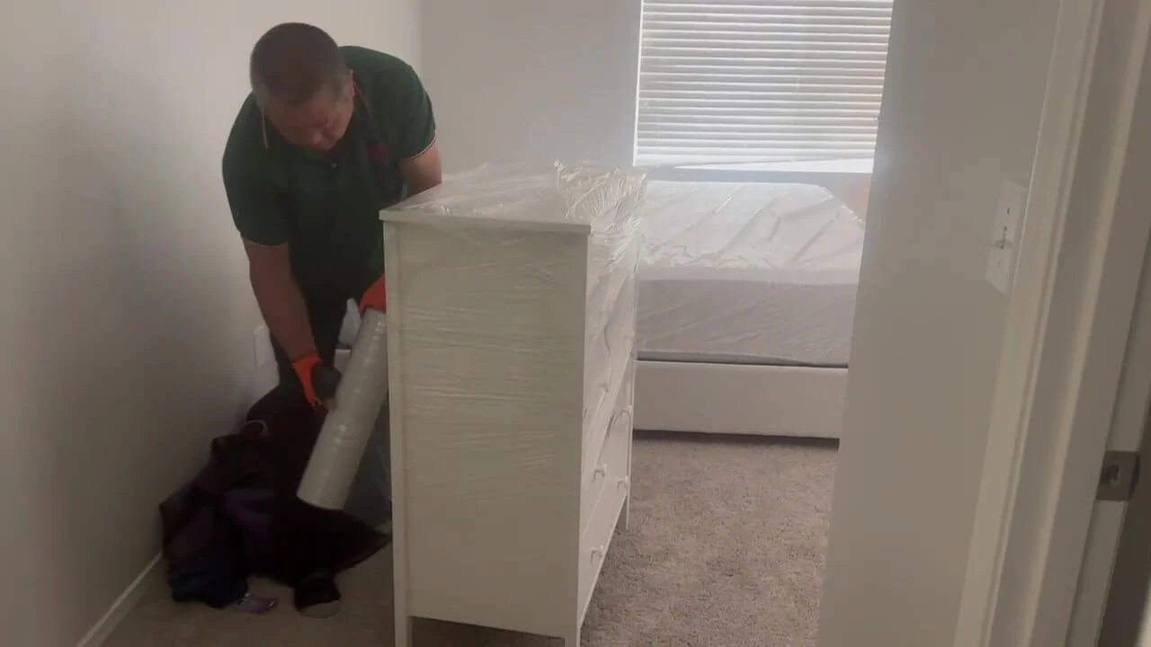 Protective wrapping inside a bedroom during a residential move