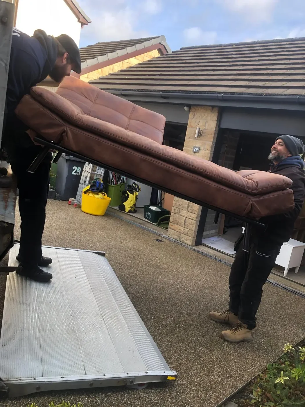 Crew carrying sofa during a residential move